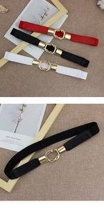 Detail of elegant gold double-ring buckle on elastic waist belt for dresses