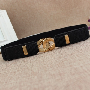Women's slim elastic belt with golden alloy chain buckle on premium beige background
