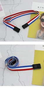 Detail of red white and blue elastic invisible belt with metal adjustment buckle