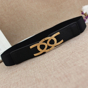Elegant women's black elastic waist belt featuring a decorative golden hollow metal buckle