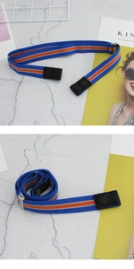 Detail of adjustable royal blue elastic belt with orange stripe and metal buckle
