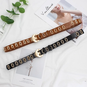 Women's black and brown faux leather belts with golden oval eyelets and pin buckles