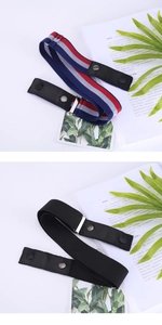 Detail view of elastic invisible belt with striped and black stretch webbing and metal buckle