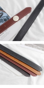 Detail showing five colors of leather belts with white stitching and silver metal buckles