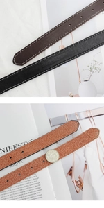 Détails de la texture du cuir avec surpiqûres blanches et épaisseur de la ceinture