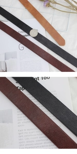 Close-up of litchi texture on stylish leather belts with sleek diagonal cut ends