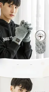 Detailed close-up of gray knitted winter gloves featuring soft texture and warm ribbed cuffs