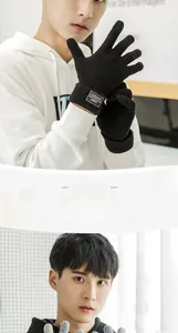Detail of men's knitted touch screen gloves with ribbed cuffs and branded fabric label