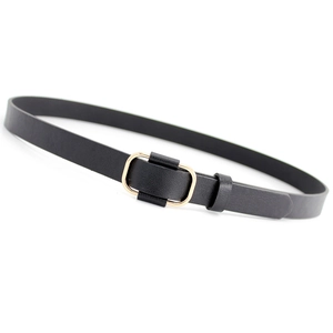 Minimalist black thin belt for women with elegant golden rectangular buckle on white background