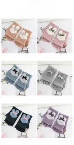 Detail view of knit fingerless gloves with plush bunny decor in six assorted pastel colors