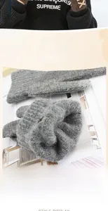 Close-up of thick grey knit fabric texture for men's touch screen winter gloves