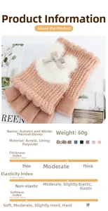 Detail of warm pink knit fingerless gloves with plush faux fur balls and bow decorations