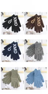 Close-up of knitted touchscreen gloves with XMD letter design in six various colors