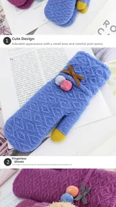 Detail view of knitted mittens featuring faux fur pom-poms and touchscreen fingertips