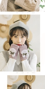 Detail of purple knitted fingerless gloves with soft white fur patches and green bows