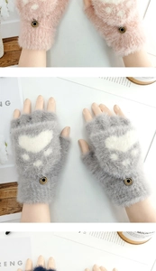 Detail of plush fingerless gloves featuring white cat paw patterns and metal button accents