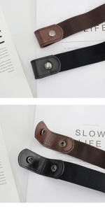 Detail of elastic no-show belts in black and brown with leather ends and metal snaps