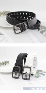 Detail of multi-hole leather belt with gunmetal buckle in black and white colors