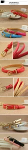 Close-up of thin patent leather belts with ornate gold metal buckles in various colors