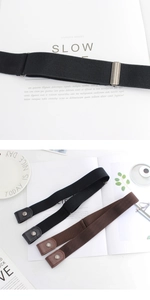Close-up of adjustable elastic belts in black and brown with metal snap buttons