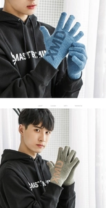 Detailed knit gloves with XMD lettering showing touchscreen tips in blue and green