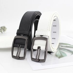 Classic black and white faux leather belts with metallic pin buckles in a minimalist style