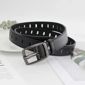 Retro black leather belt with all-over holes and square metal buckle on a clean desk