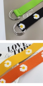 Detailed view of canvas daisy belts in green, black, yellow, and orange with D-ring buckles