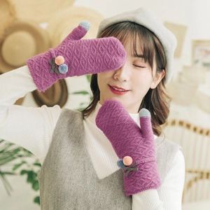 Winter knit mittens in dark purple with plush pom poms and stylish diamond pattern