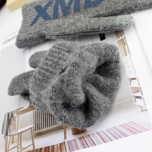 Gray knitted winter touchscreen gloves with fuzzy texture and navy blue letter patch