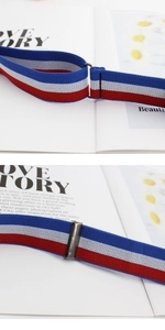 Close-up of red white and blue elastic striped belt with durable metal buckle rings