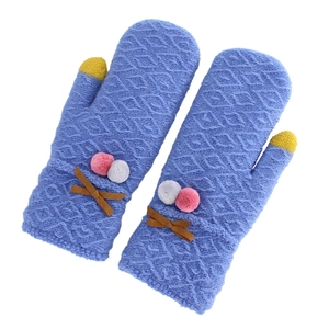 Thick navy knit mittens with plush poms, bow details and yellow contrast fingertips