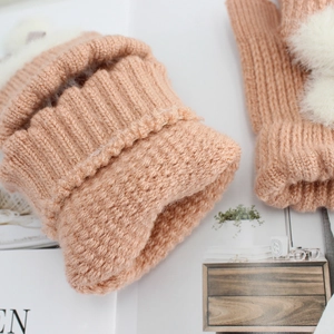 Women's warm winter knitted half-finger gloves with plush rabbit pom poms in soft beige
