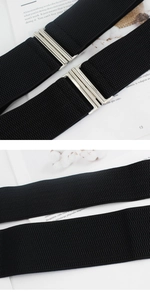 Close-up of black elastic waist belt with silver metal buckle and woven texture detail