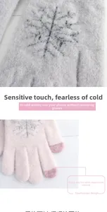 Close-up of touchscreen fingertips and snowflake pattern on winter knitted gloves