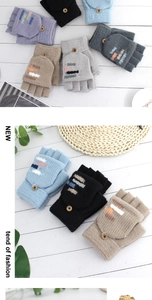Detailed view of knitted convertible gloves with wooden buttons and colorful stripes