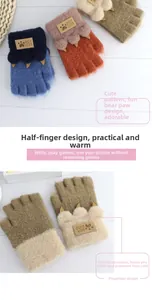 Detail view of kids knit half-finger mittens with cute animal paw and leather logo patch