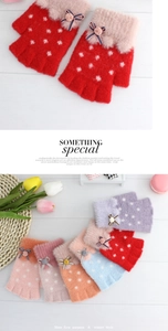 Close-up of winter knitted half-finger gloves featuring faux fur trim and bow accents