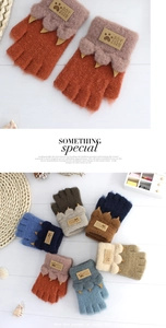 Detailed macro view of thick knitted half-finger gloves with cute leopard paw design