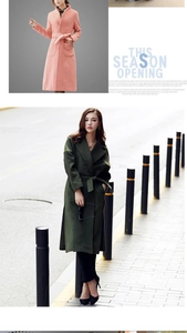 Close-up of wool blend coats in pink and dark green with matching waist belts and large pockets