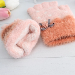 Plush knit fingerless gloves for kids in pink featuring cute bows and polka dots