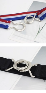 Close-up of the silver metal interlocking buckles on the elastic striped waist belt