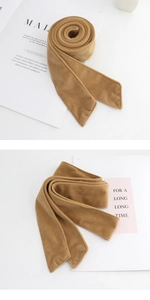 Detail view of camel wool belt for coats featuring soft matte texture and rich fabric
