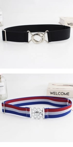 Close-up of two elastic waist belts with interlocking silver and floral metal buckles
