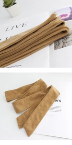 Detailed close-up of camel wool belt featuring double-sided sewing for coats