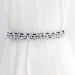 Elastic black waist belt for women featuring sparkling crystal heart rhinestones on a dress