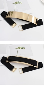 Macro shot showing detail of the gold mirror metal plate and black elastic waist belt
