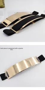 Detail showing gold metallic mirror belt buckle with protective film on black elastic band