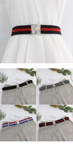 Detail of adjustable elastic stretch belts in four striped colorways with metal buckle