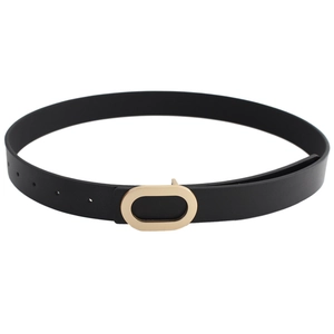 Minimalist black faux leather belt for women with a polished gold oval metal buckle